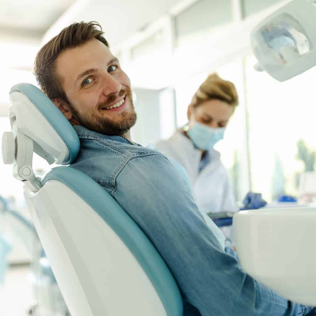 smiling dental patient in chair
