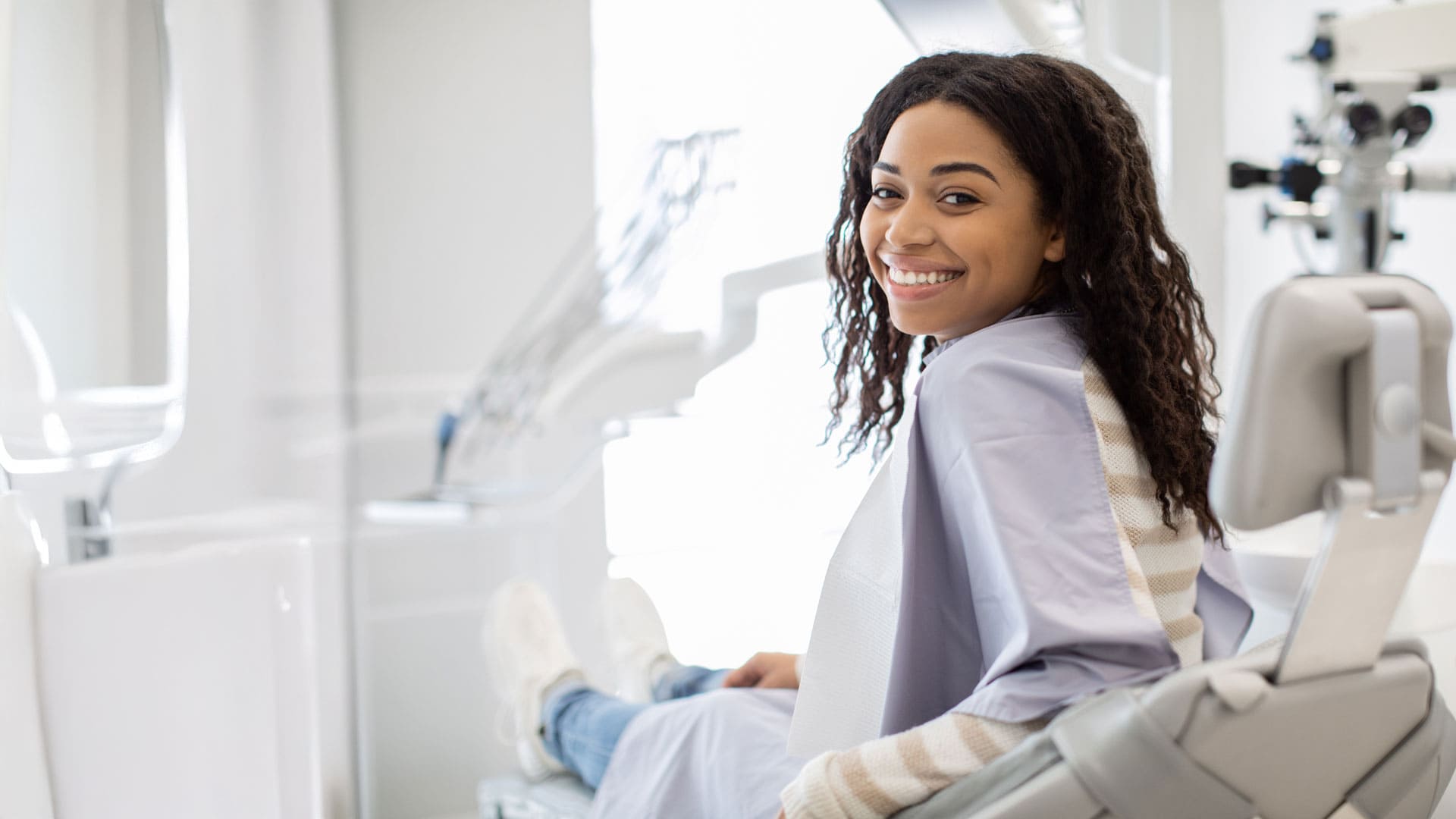 smiling patient in dental chair